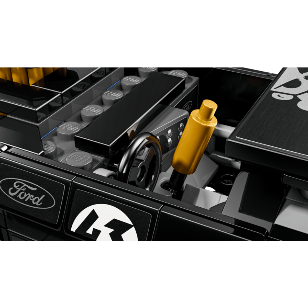 Close-up of the Lego Hoonicorn V1 77262 cockpit showing the steering wheel and gold drift brake lever