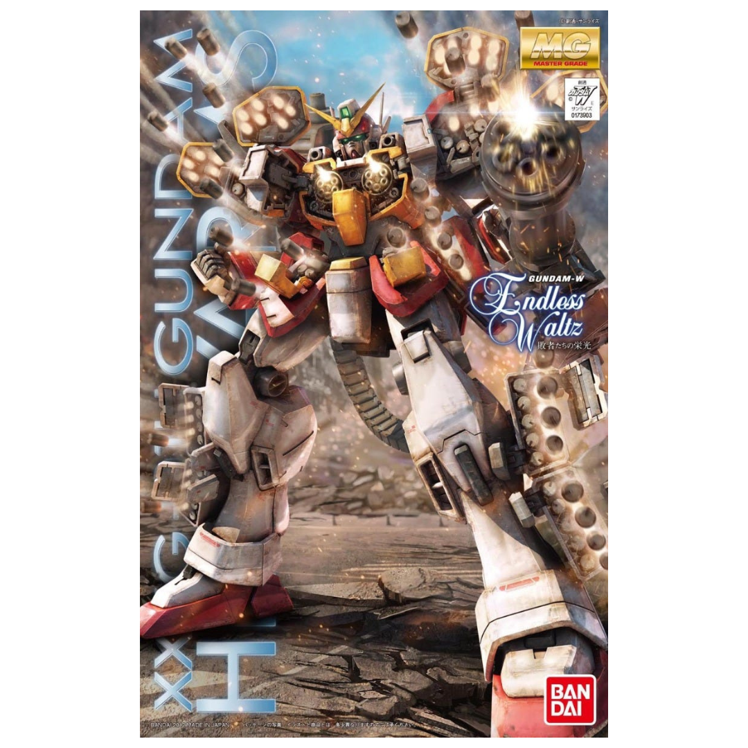 Bandai MG Gundam Heavyarms (EW) Gundam Wing: Endless Waltz box art featuring the iconic Mobile Suit with its dual Gatling guns and missile pods.