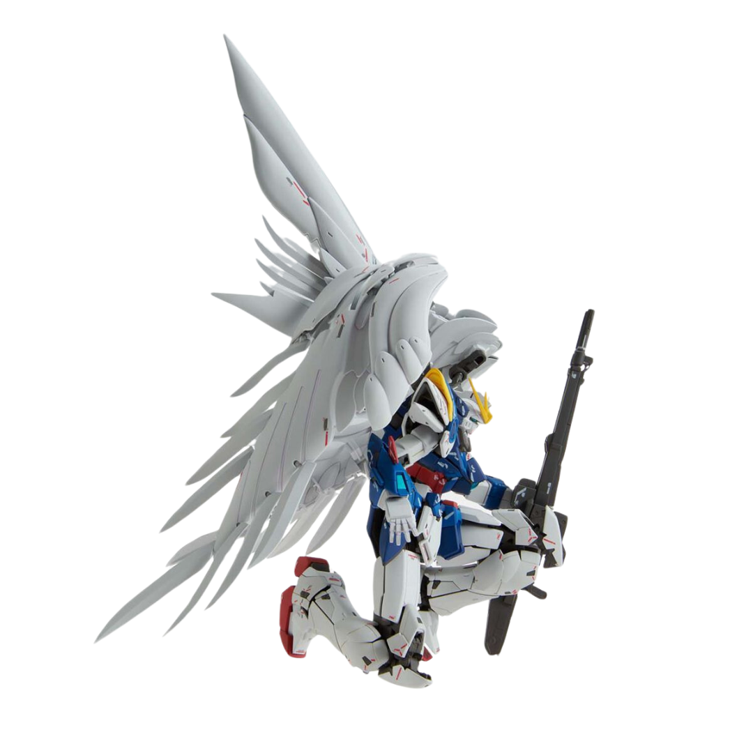  MG Wing Gundam Zero (EW) Ver.Ka in a dynamic action pose with wings fully extended, ready for battle.