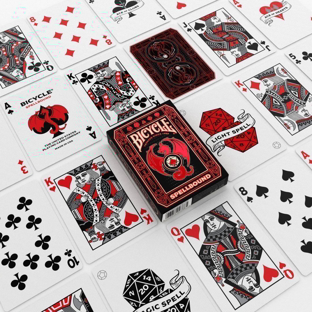 Bicycle Spellbound playing cards with crimson foil tuck case, dragon and sword design, spell‑joker cards