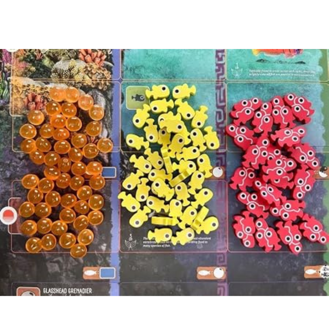 Finspan Upgrade Pack with wooden young tokens school tokens and squishy egg tokens on Finspan game board