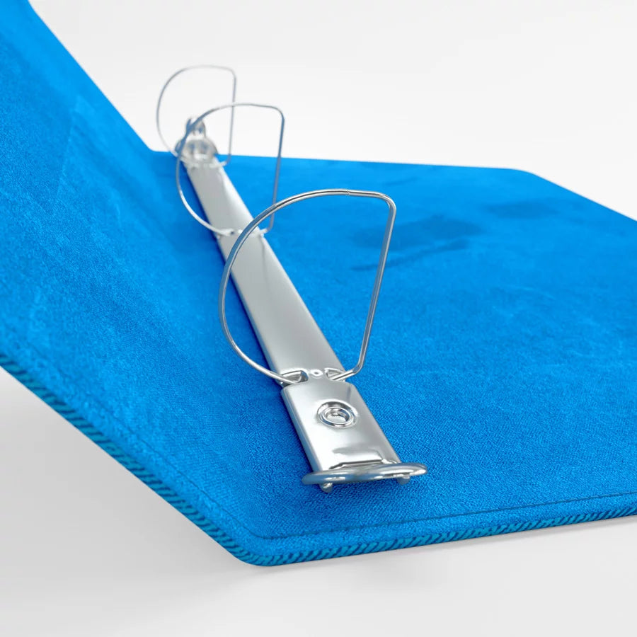Close-up of blue Gamegenic D-ring binder spine and reinforced corner design for durability

