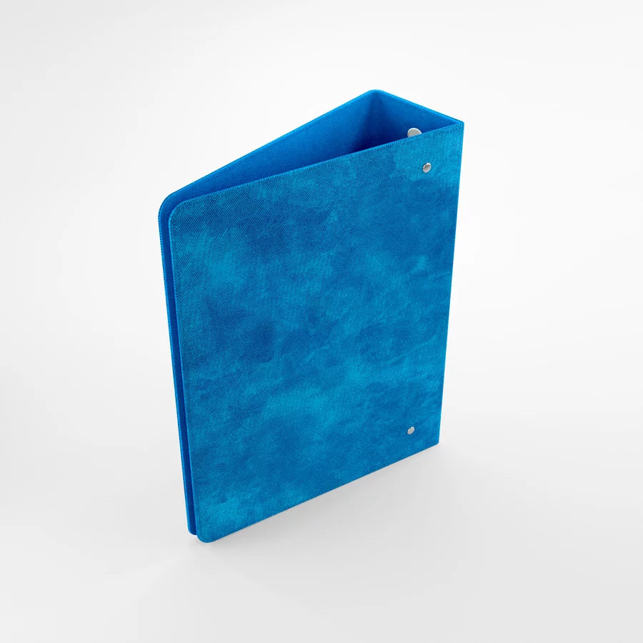Blue Gamegenic D-ring binder standing upright with visible spine and sleek matte finish for trading card storage 