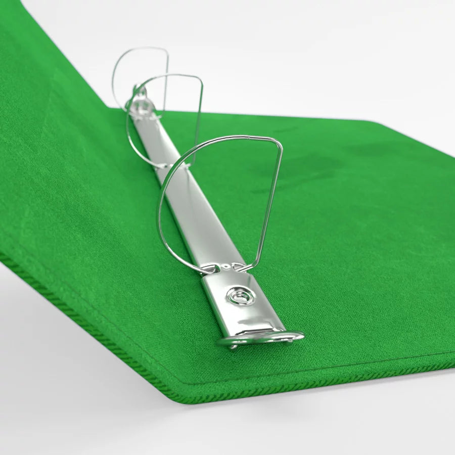 Green Gamegenic D-ring binder lying flat, displaying sturdy cover and secure ring mechanism 