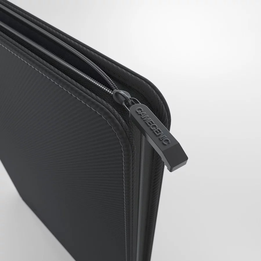 Close-up of black Gamegenic zip-up D-ring binder zipper and reinforced corner design for durability

