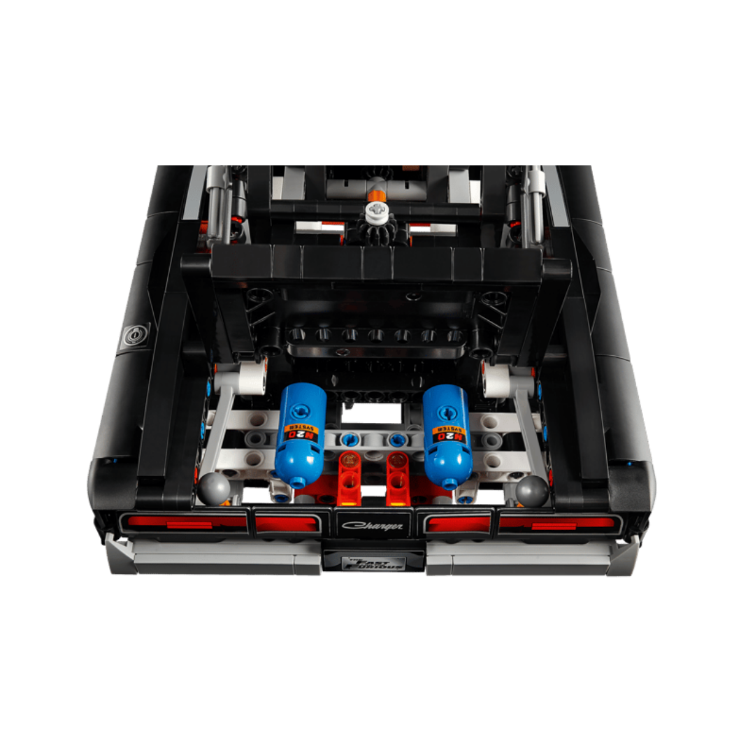 Rear compartment of LEGO Dodge Charger R/T 42231 showing two blue NOS bottles and detailed Technic mechanisms