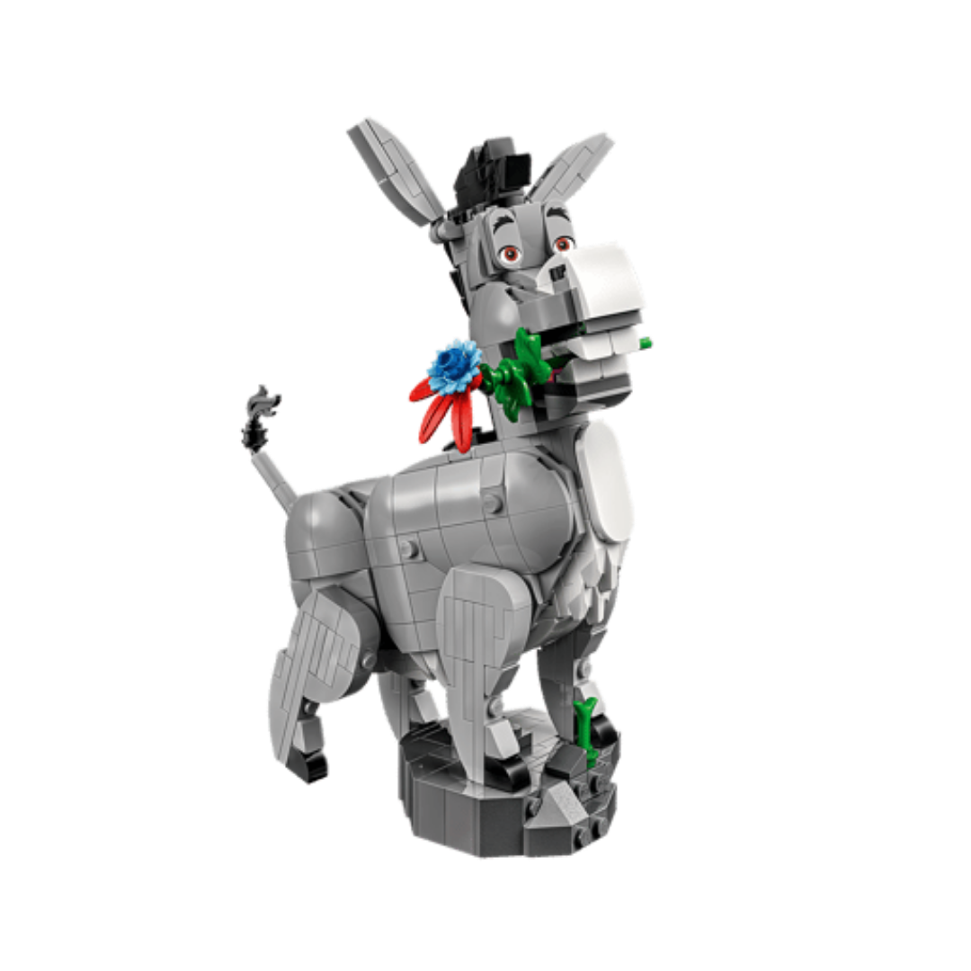 Lego Donkey figure from Shrek set 72423 standing on a rocky base while holding a colourful flower