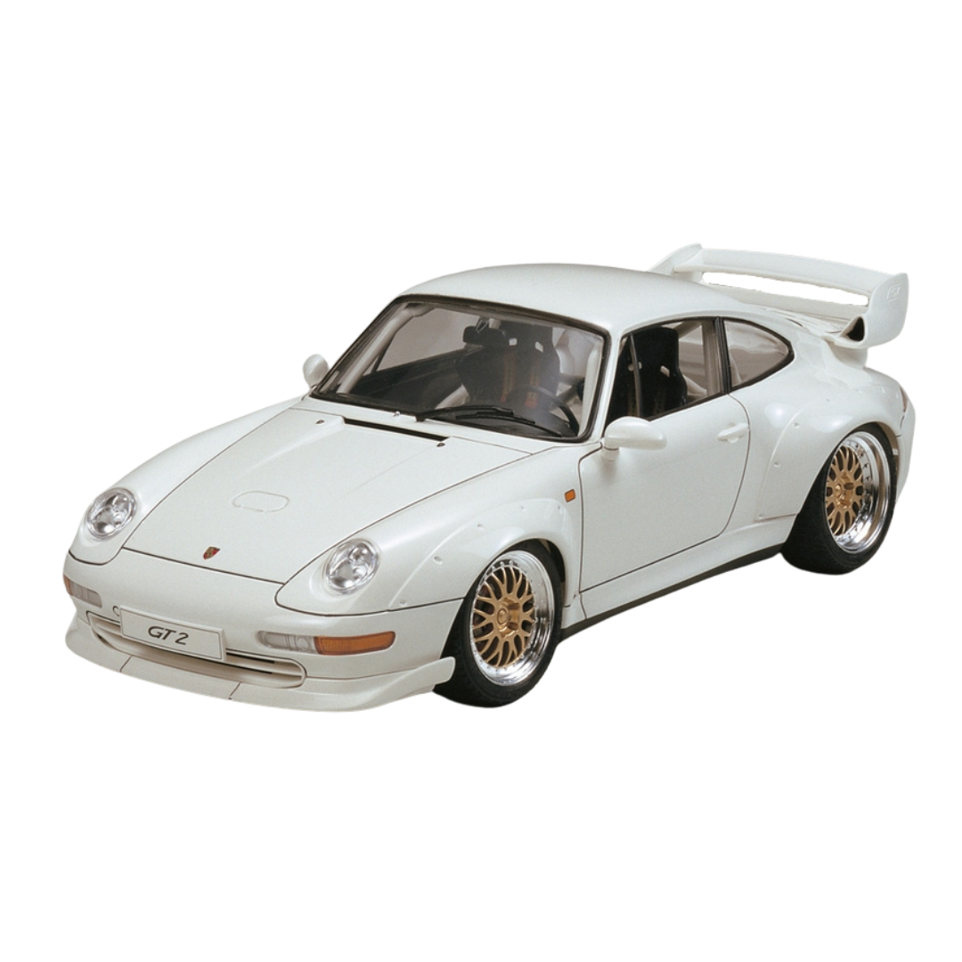 1/24 scale Tamiya Porsche GT2 Street Version model kit featuring detailed screw-fastened over fenders, an oversized rear wing, a crisply reproduced interior with roll cage, metal transfer parts for wheels, headlights, and reflectors, and solid rubber tires for realistic texture and tread