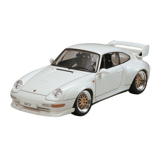 1/24 scale Tamiya Porsche GT2 Street Version model kit featuring detailed screw-fastened over fenders, an oversized rear wing, a crisply reproduced interior with roll cage, metal transfer parts for wheels, headlights, and reflectors, and solid rubber tires for realistic texture and tread