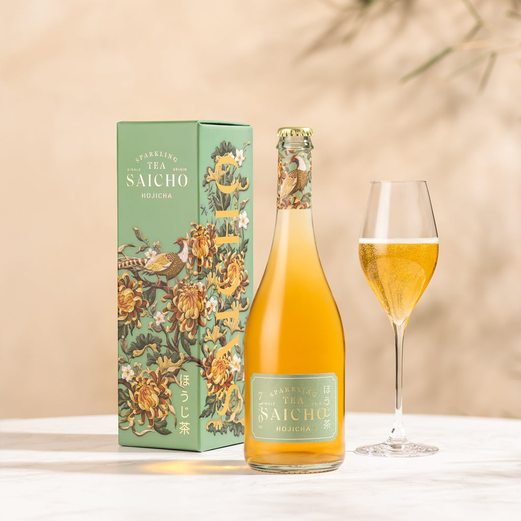 Bottle of Saicho Hojicha Sparkling Tea with a glass of yellow liquid on a beige background