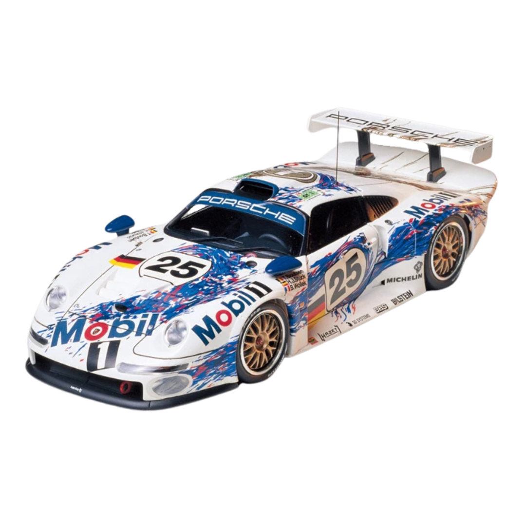 1/24 scale Tamiya Porsche 911 GT1 model kit featuring a detailed racing interior with a roll cage, removable rear cowl, and decals to replicate the authentic livery of the iconic endurance race car.