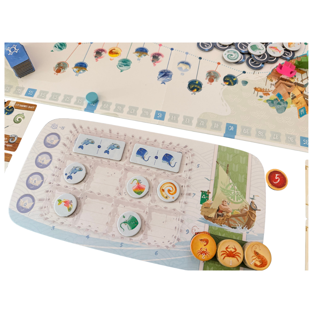 Namiji close-up of a boat mat with coloured fish tiles and round tokens beside the game board